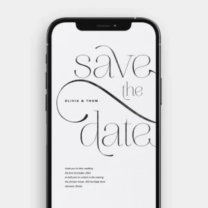 A still image from the animated wedding video invitation, showing delicate black calligraphy on a textured white background with an ink drop effect.